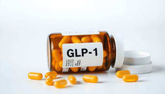 Amber bottle labeled GLP-1 with yellow capsules spilled around for Cagrillintide Semaglutide supplement