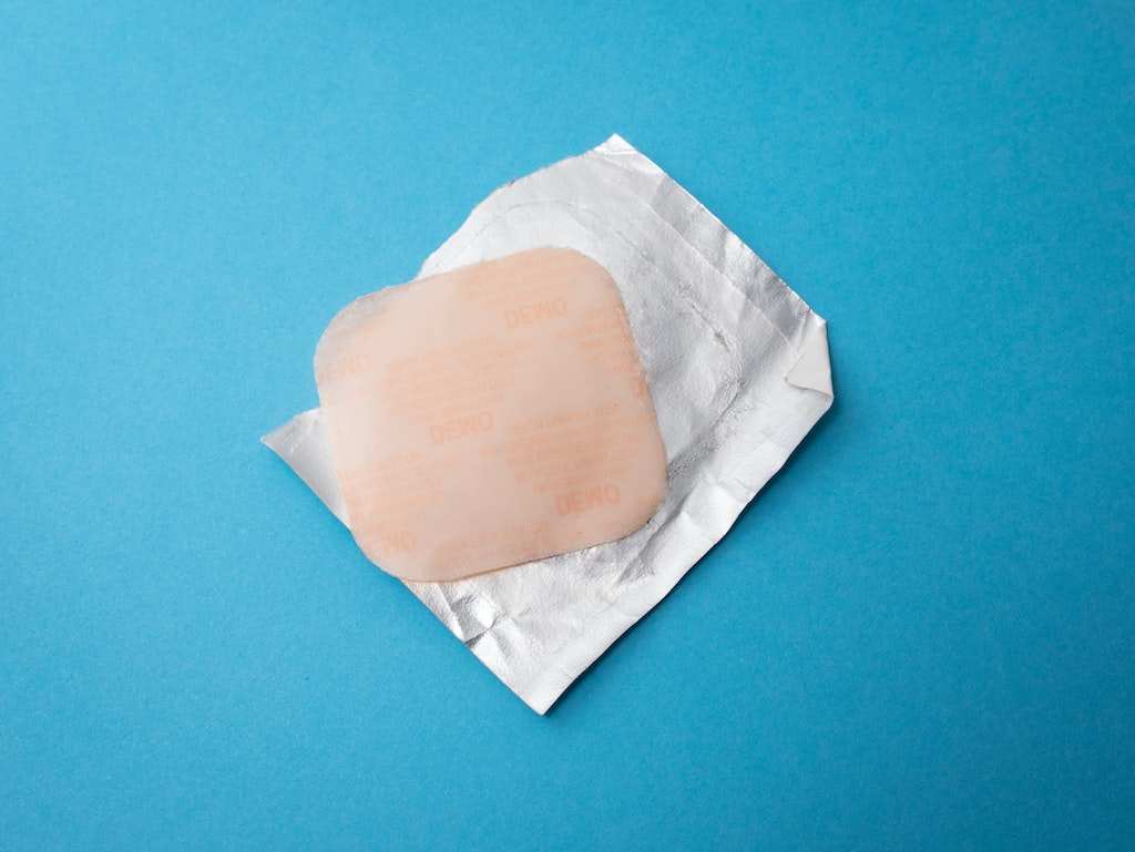 natural hormone replacement therapy patch on blue background